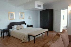 3 person deluxe suite with sea view, balcony, private facilities (bath and shower), and breakfast